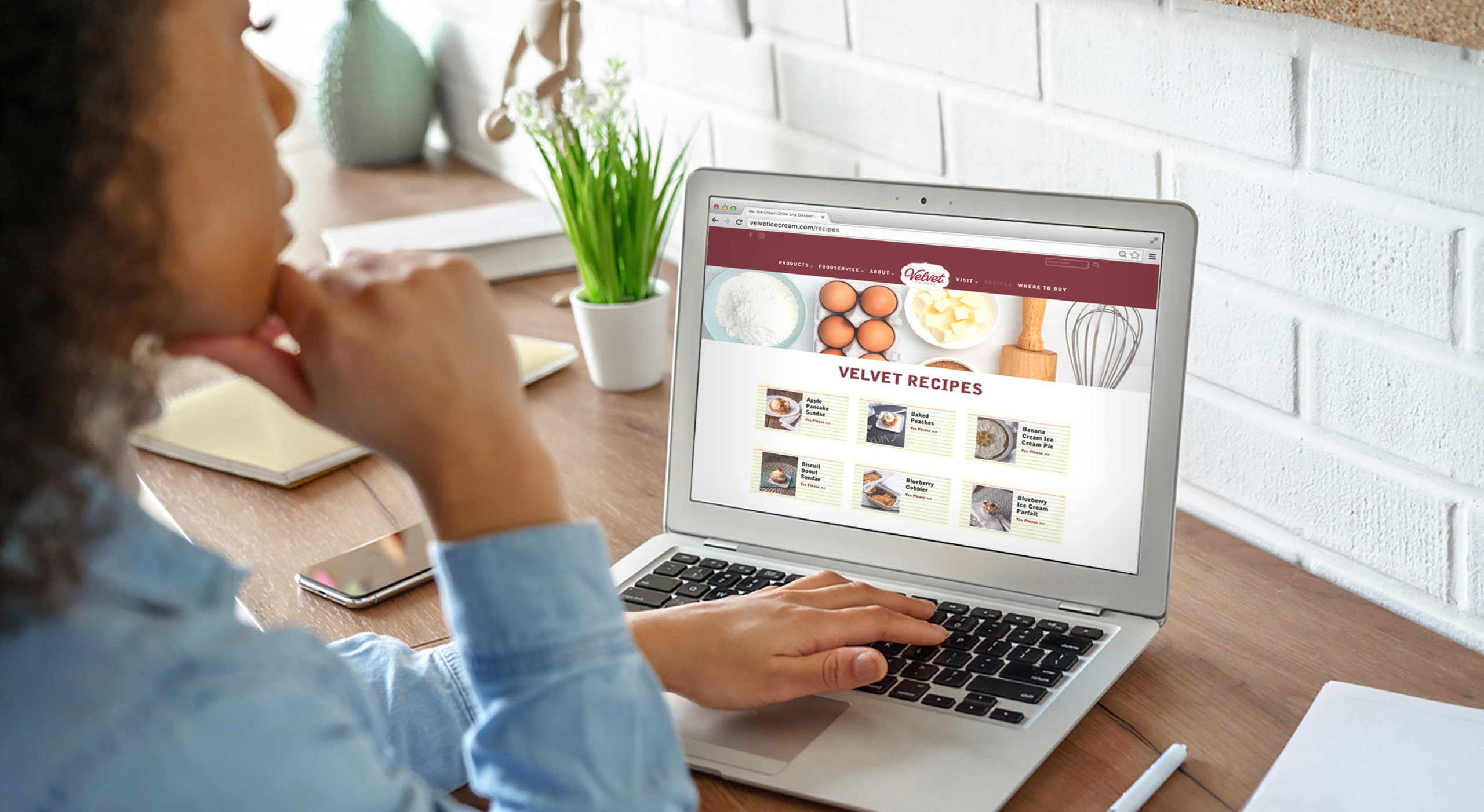 African girl student watching video course, distance e-learning, studying with online teacher by webcam. Remote education, work from home concept. Over shoulder close up laptop mock up screen view.